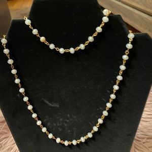 Gold plated pearl necklace.